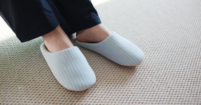 person-with-cozy-light-blue-fuzzy-slippers-indoor